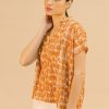 Blusa fluida estampado teja